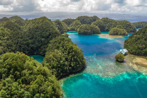 Aerial shot a Limestone islands form a remote lagoon in northern Raja Ampat, Indonesia
